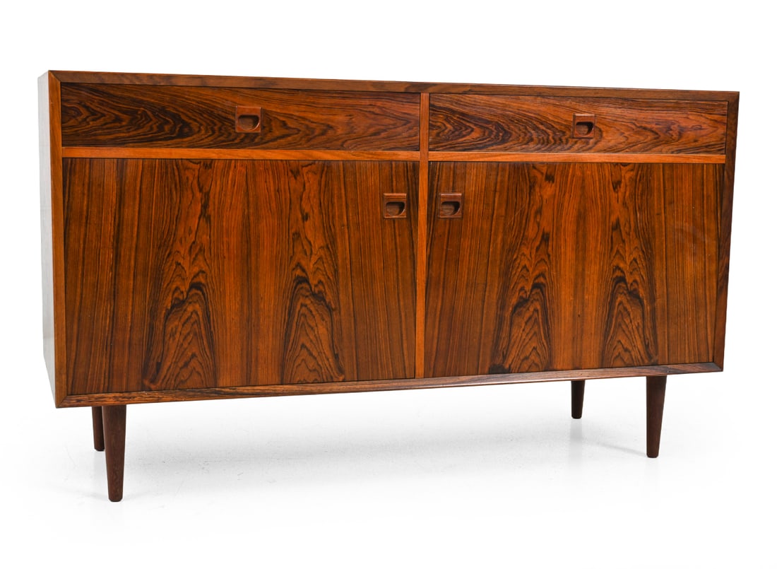 ERIK BROUER DANISH ROSEWOOD CABINET C. 1960S: Cabinet with felt lined drawers and interior shelves. Stamped on backside. Dimensions: H 31'' x W 53.5'' x D 20" Condition: Sun fading/discoloration. Scuffs and dings.