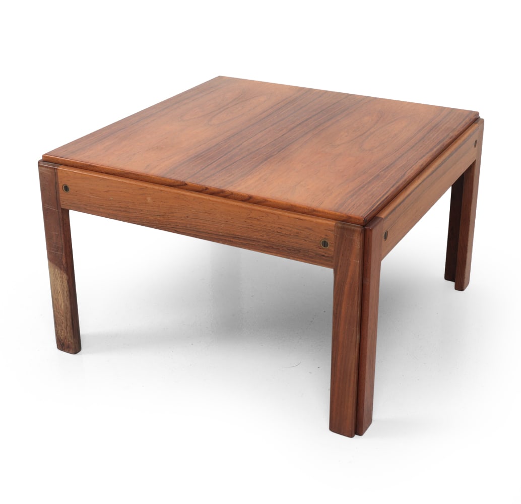 EDMUND JORGENSEN DANISH ROSEWOOD SIDE TABLE: Square rosewood table, exposed dowel details. Marked to underside. Denmark, Circa 1960s. Dimensions: H 13.5" x W 22.5? x D 22.5? Condition: Sun fading, scratches and rubs. Discoloration to leg. Wear c