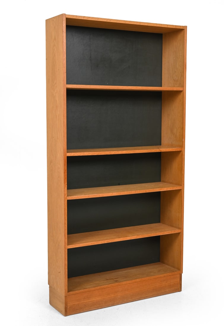 ATTR. DOMINO MOBLER DANISH OAK BOOKCASE C. 1960S: Oak bookcase with open shelving, contrasting dark back panels. Apparently unmarked. Denmark, circa 1960s. Dimensions: H 63'' x W 31.5'' x D 9" Condition: Light surface wear consistent with age and use