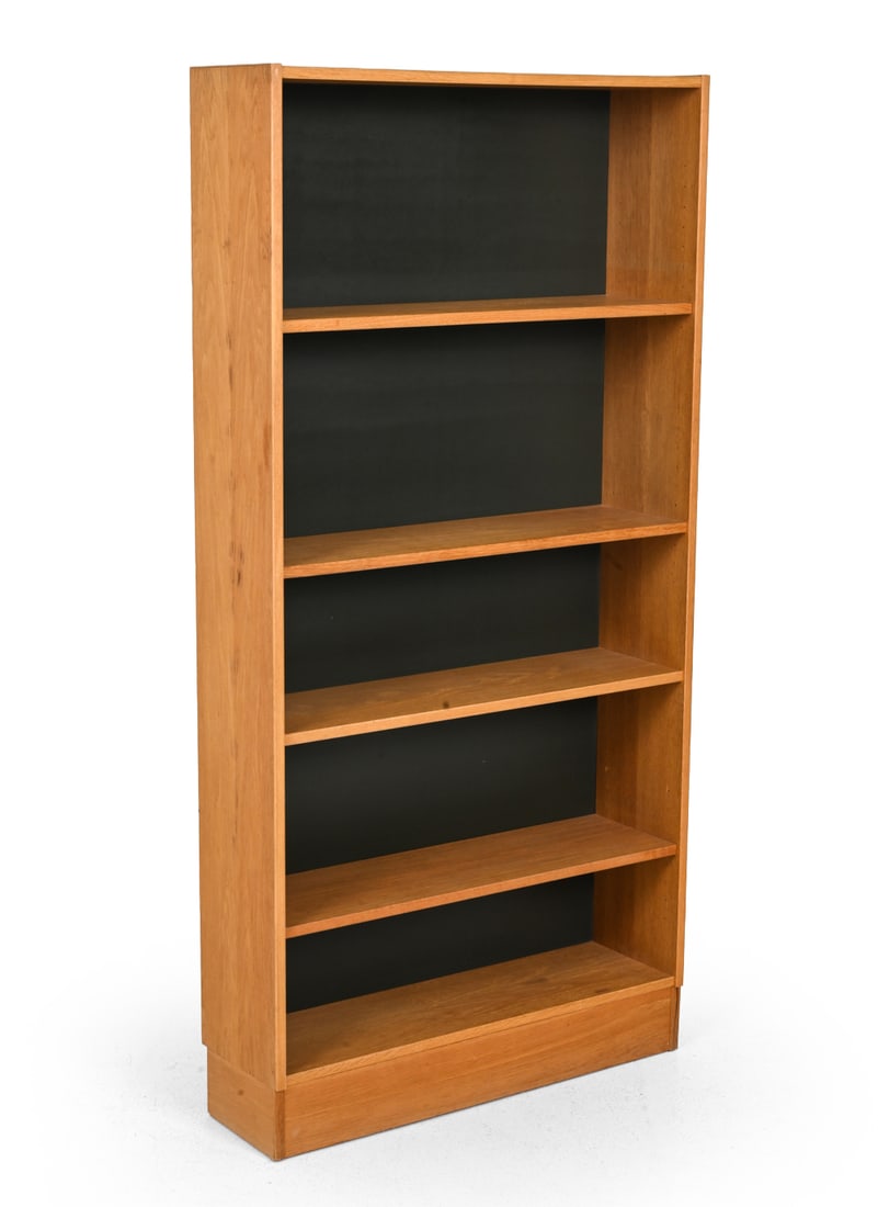 ATTR. DOMINO MOBLER DANISH OAK BOOKCASE C. 1960S: Oak bookcase with open shelving, contrasting dark back panels. Apparently unmarked. Denmark, circa 1960s. Dimensions: H 63'' x W 31.5'' x D 9" Condition: Wear consistent with age and use. Water marks 
