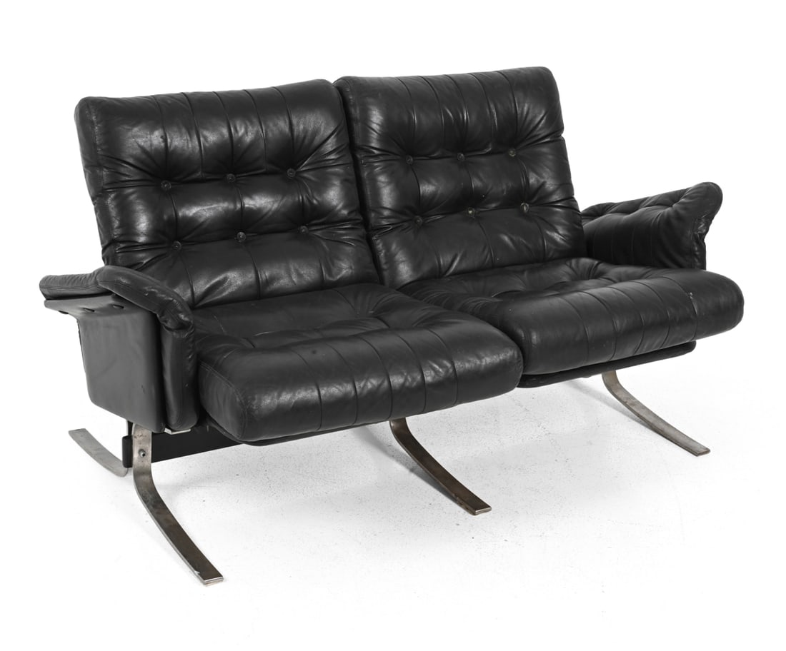SOREN NISSEN AND EBBE GEHL ATLANTIS LEATHER SOFA: Metal base with black tufted leather upholstery. For Jeki Mobler. Apparently unmarked. Dimensions: H 31.5" x W 58.25" x D 31" x SH 18" Condition: Fading/discoloration to cushions. Wear/crackling to le