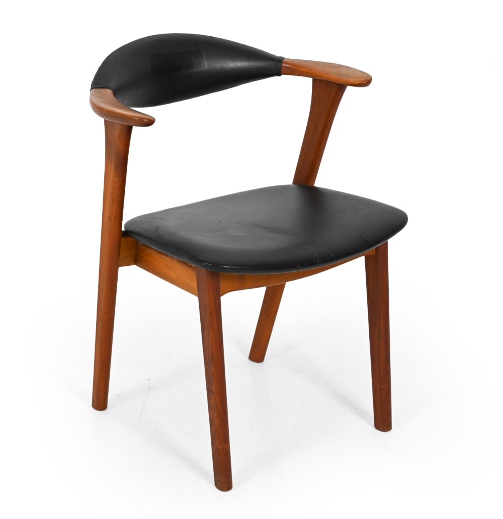 ERIK KIRKEGAARD DANISH TEAK ARMCHAIR C. 1960S: Teak with curved back and black faux leather seat and back. Apparently unmarked. Denmark, circa 1960s. Dimensions: H 29'' x W 23.5'' x D 19.5" S.H.17" Condition: Showing signs of wear including scuffs