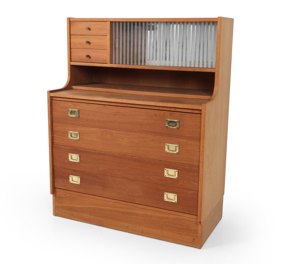 DANISH OAK SECRETARY CHEST W/ BAR CABINET C. 1970S: Oak secretary bookcase chest with drawers at the bottom and top, sliding glass doors for and a lit up mirrored back dry bar. Apparently unmarked. Dimensions: H 44" x W 35" D 18" Condition: Few water