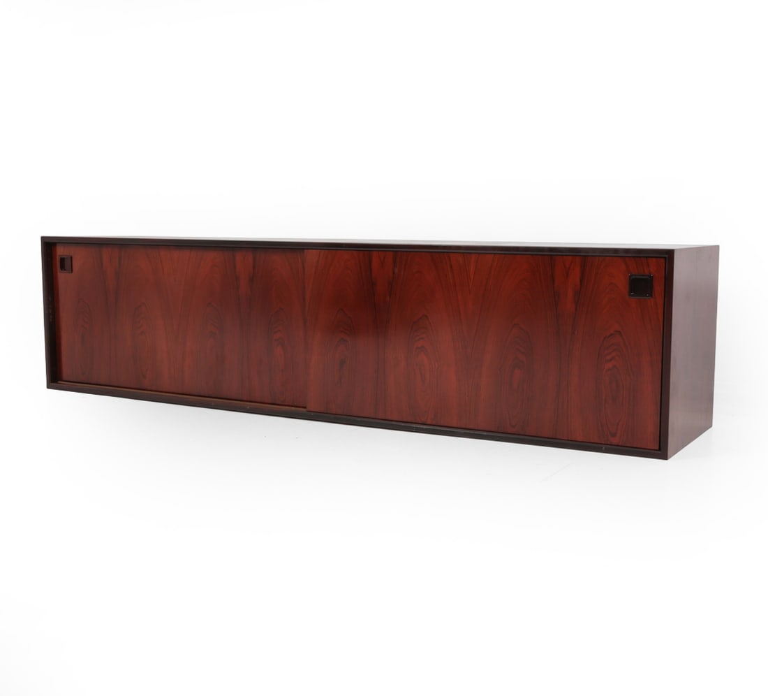 OMANN JUN MODEL 29 DANISH ROSEWOOD SIDEBOARD: Rosewood sideboard with sliding doors, felt-lined drawers and interior shelves. Labeled on backside. Dimensions: H 31" x W 83" x D 18.5? Condition: No base or legs included. possibly could be wall