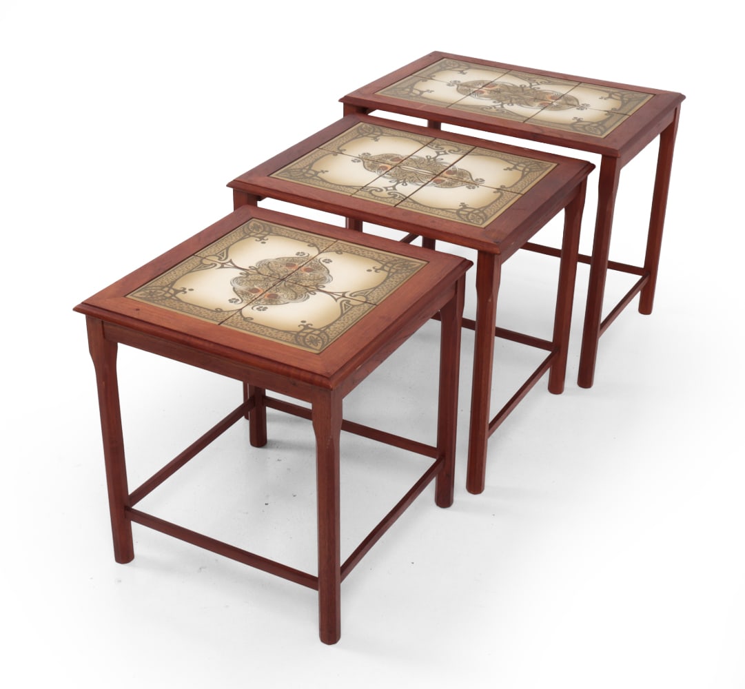 TOFTEN DANISH TEAK & TILE NESTING TABLES C. 1960S: (3) teak nesting tables with floral ceramic tile tops. Denmark, circa 1960s. Dimensions: H 18.75" x W 22? x D 15.5? Condition: Some water stains, scratches and rubs. Wear consistent with age and use. 