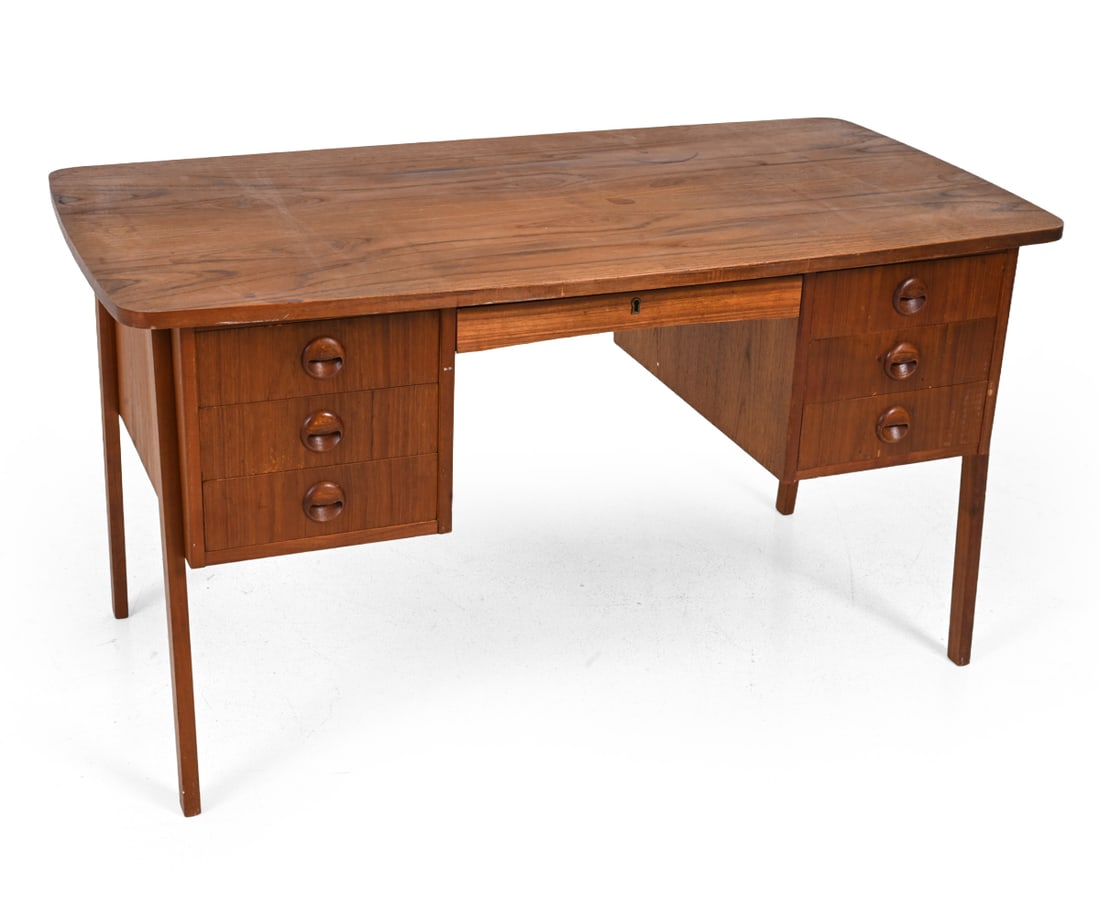 KRISTIANSEN STYLE DANISH TEAK WRITING DESK 1960S: Teak double pedestal writing desk with seven drawers. Denmark, circa 1960s. Dimensions: H 29" x W 53.5 ?x D 26.5? Condition: Showing signs of wear including scratches, discoloration and areas of