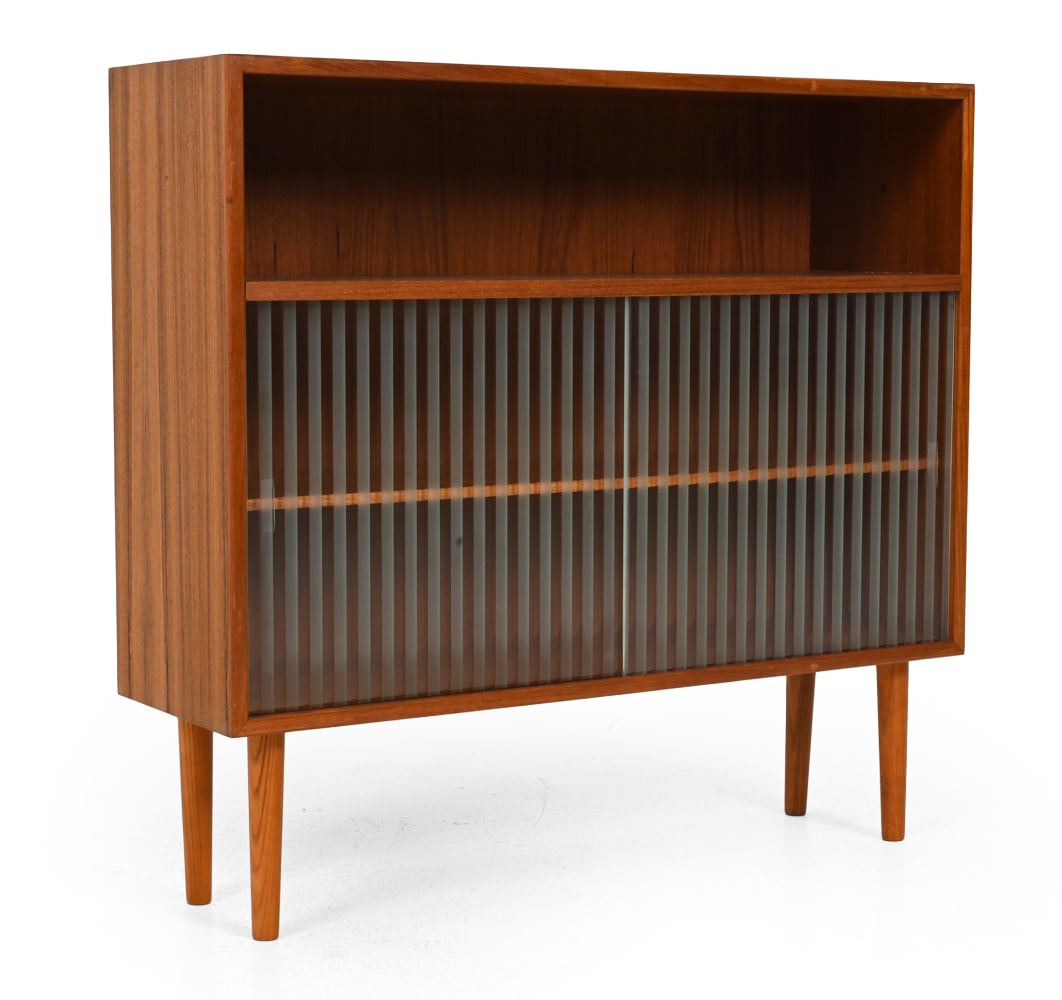HJORNEBO DANISH TEAK BOOKCASE CABINET: Teak frame with sliding glass doors. Denmark, circa 1960s. Dimensions: H 32" x W 34? x D 10" Condition: Light wear consistent with age and gentle use. L043