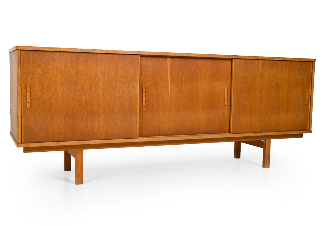 SWEDISH OAK SIDEBOARD C. 1960S: Oak sideboard with sliding doors, vertical pulls, adjustable interior shelving. Sweden, circa 1960s. Dimensions: H 32" x W 83? x D 20.5? Condition: Wear consistent with age and use, including small lo