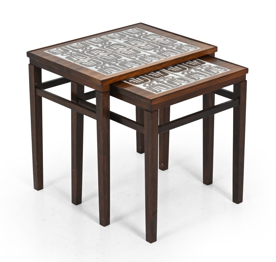 EDMUND JORGENSEN ROSEWOOD & TILE NESTING TABLES: (2) Marked underneath. Rosewood with inlaid tile tops. Denmark, circa 1960s. Dimensions: (larger) H 18.5'' x W 18.5'' x D 14" Condition: Showing light signs of wear consistent with age and use. L126