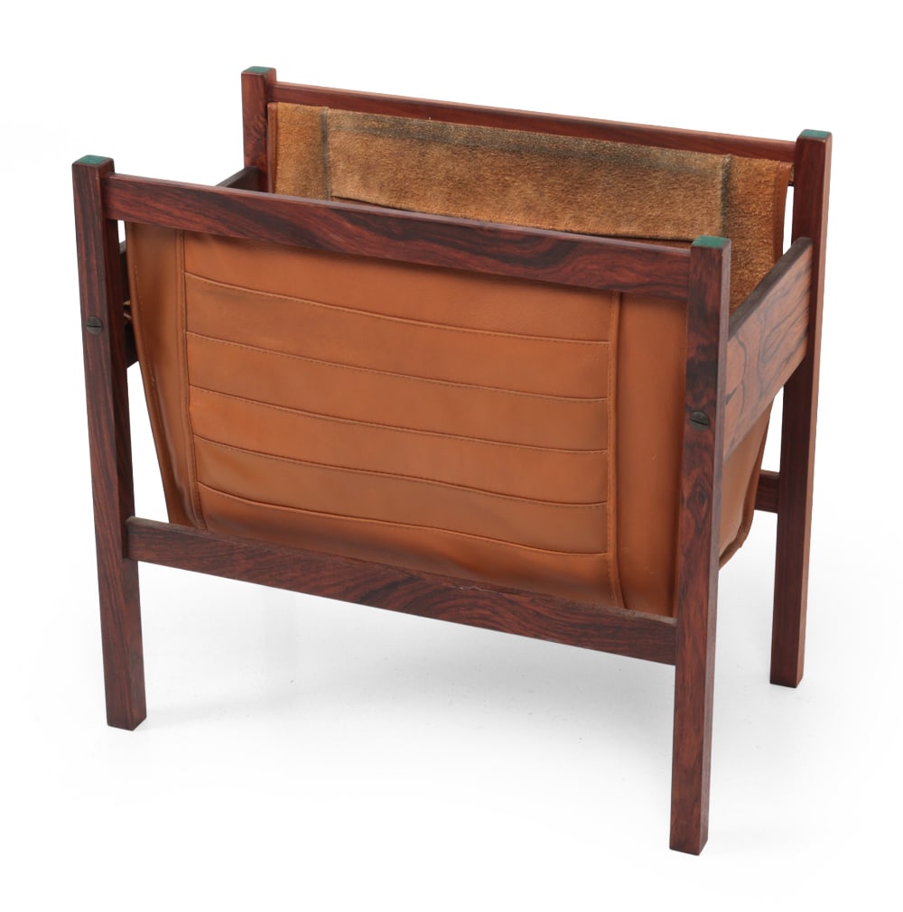 TORBJORN AFDAL ROSEWOOD & LEATHER MAGAZINE RACK: Rosewood frame and leather sling. Apparently unmarked. Norway, circa 1960s. Dimensions: H 17" x W 17.75 ?x D 10.25? Condition: Some wear to leather inside. Wear consistent with age and use.