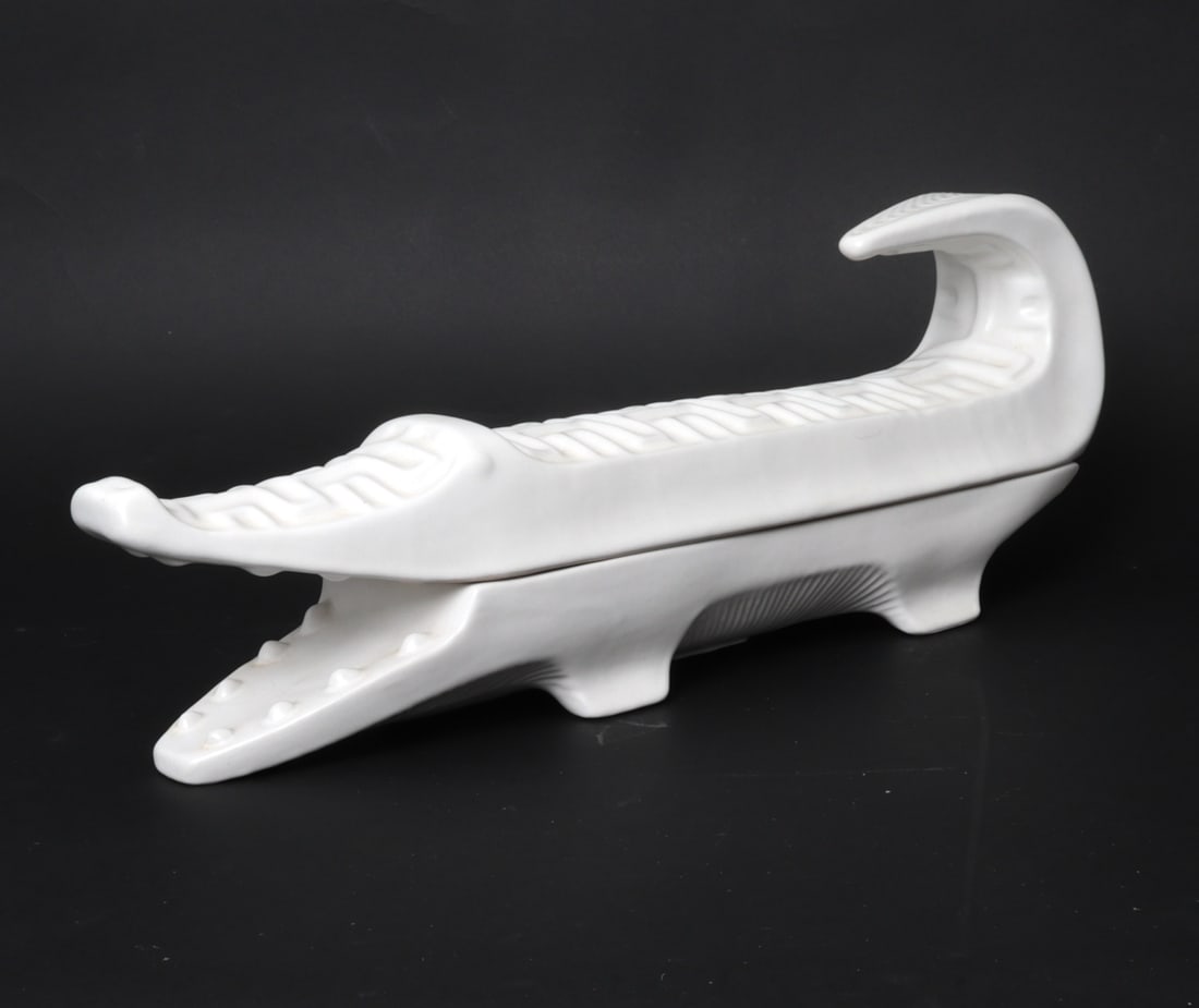 JONATHAN ADLER MENAGERIE CERAMIC CROCODILE BOX: White ceramic lidded box in the design of a crocodile. Labeled and numbered 19/250 on underside. Dimensions: H 6.5" x W 5" x D 19.5 " Condition: Very light handling marks consistent with age and use.