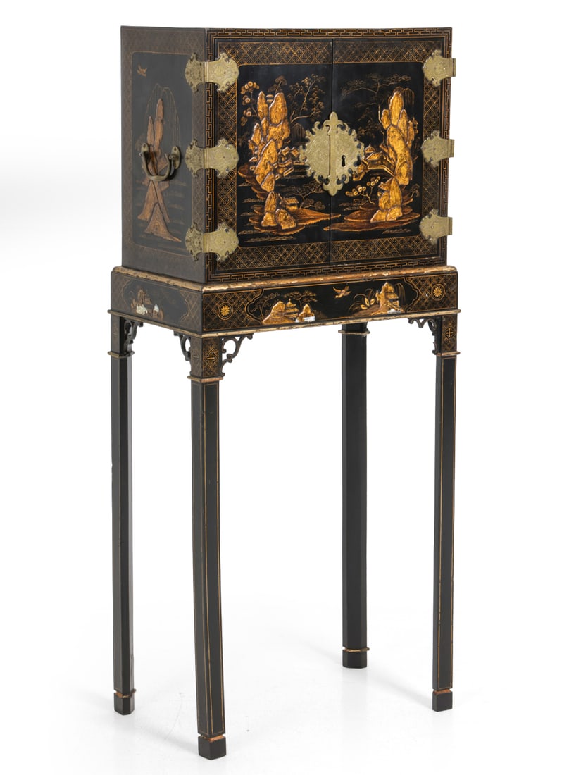 18TH C. JAPANESE STYLE GILT & LACQUER CABINET: Key included. Features black lacquer and raised gilt decoration depicting landscapes, pagodas and mountainous scenery. Pitt & Scott Ltd Label on backside. Dimensions: H 49" x W 21.5" x D 13.25"