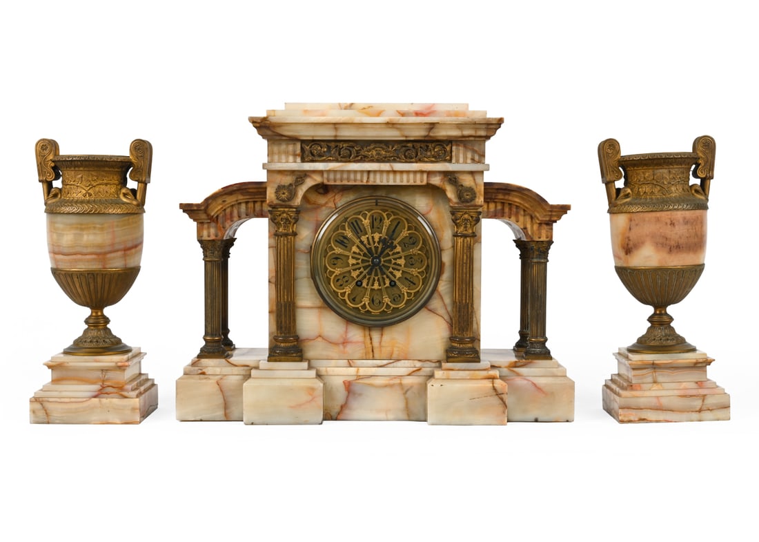 FRENCH ORMOLU ONYX MARBLE MANTEL CLOCK & URNS: Apparently unmarked. Gilt brass and marble. France, early 20th century. Dimensions: (urn) H 15.25" x W 6" x D 5" (clock) H 16.75" x W 21.25" x D 6.5" Condition: Scratches and patina of brass. Clock