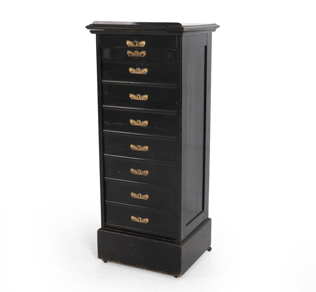 GERMAN TAMBOUR MUSIC CABINET C. 1930S: Includes key. Cabinet with tambour door with faux drawer fronts, and shelves inside the unit. Features brass hardware. Germany, circa 1930s. Dimensions: H 47.25" x W 19.5" x D 17.25" Condition: Wear
