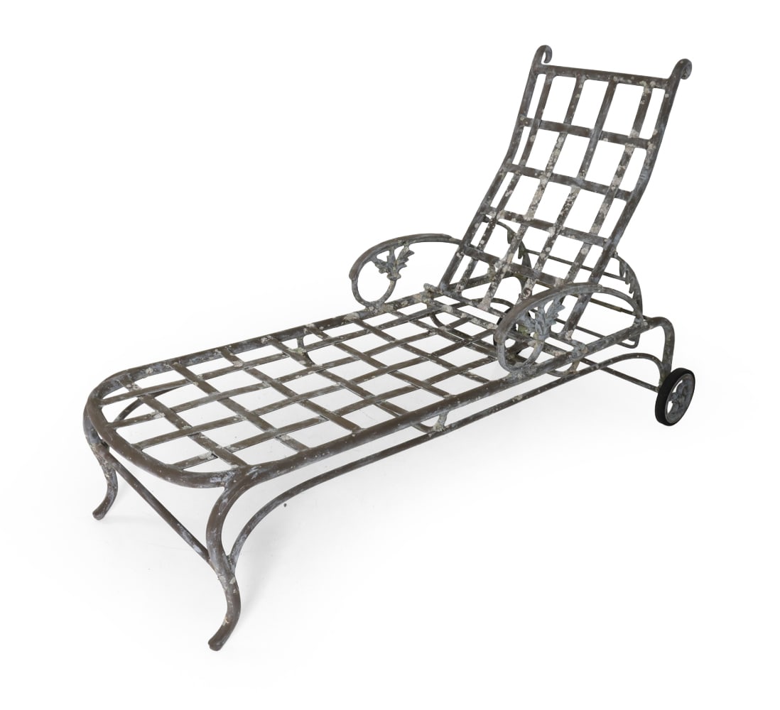 ATTR. TROPITONE CAST ALUMINUM CHAISE LOUNGE: Lattice-patterned seat and reclining backrest. Curved frame with scrolled terminals and rear wheels. 20th century. Dimensions: H 42" x W 27.5" x D 77" x SH 17.25". Condition: Aged patina with heavy li