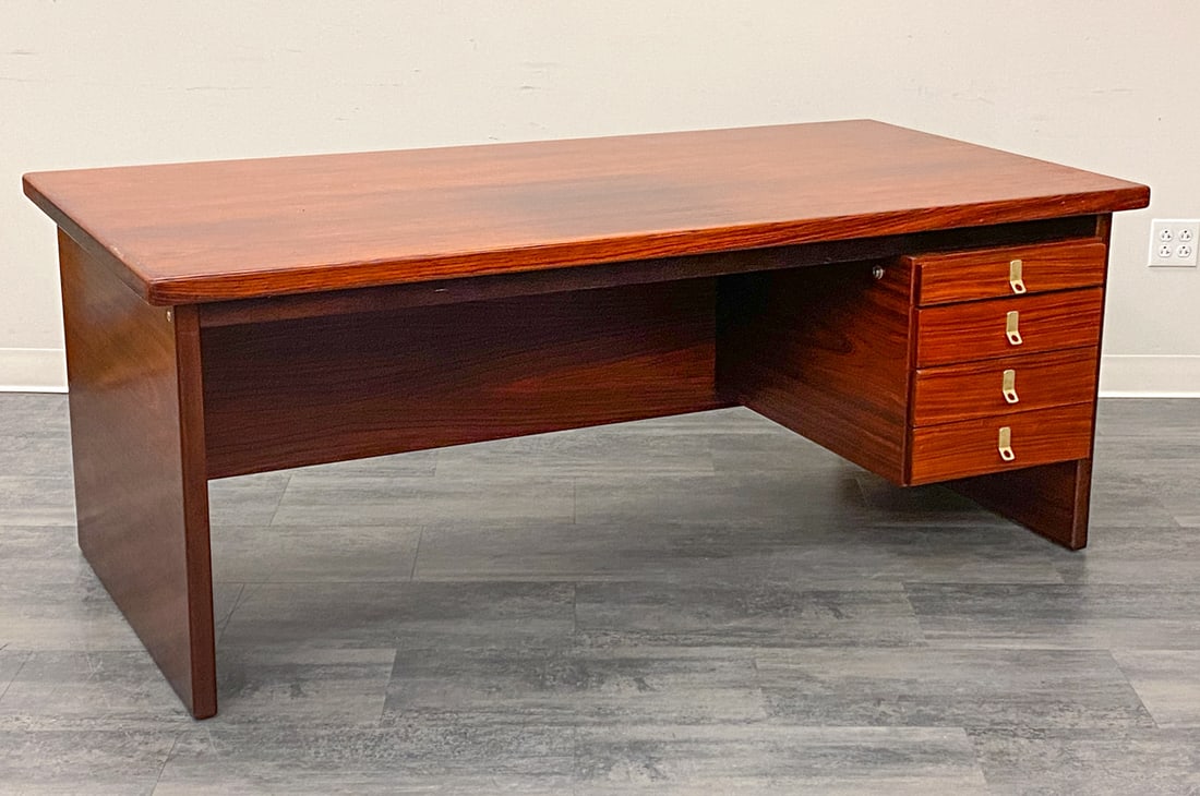 DANISH ROSEWOOD EXECUTIVE DESK: Dimensions: H 28.5" x W 73" x D 37" Condition: Wear consistent with age and use. Scuffs, , fading, some scratches to top. Bottom and top drawer are slightly stiff.