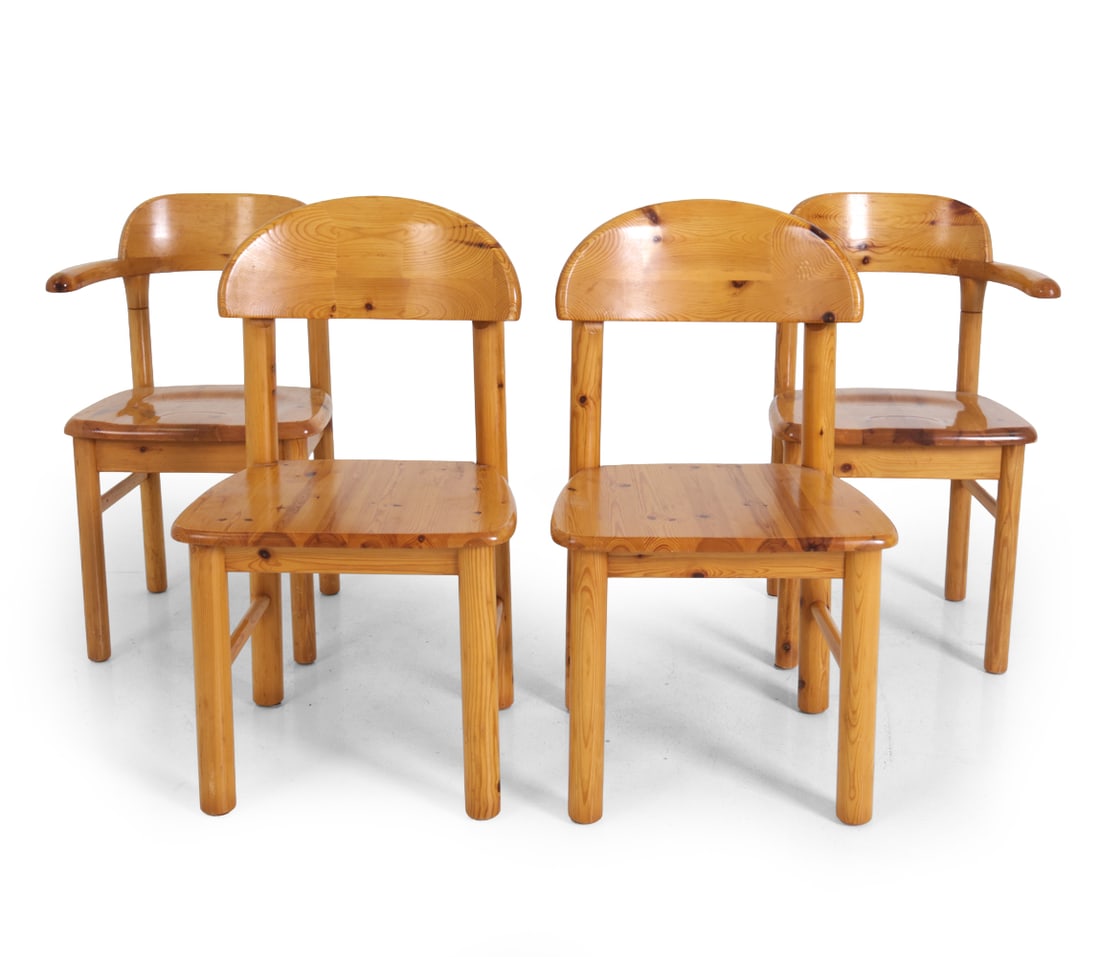 (4) STYLE OF DAUMILLER DANISH PINE DINING CHAIRS: Two armchairs and two side chairs. Denmark, circa 1970s. Dimensions: SH 18 '' x (Largest) H 34 " x (Armchair) W 21 " x D 19.5 Condition: Light surface wear consistent with age and use. Few dings,