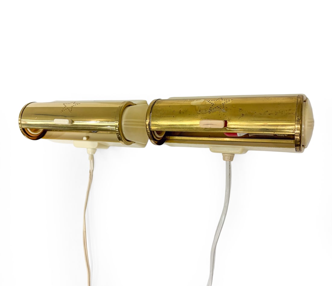 PAIR OF SCANDINAVIAN BRASS WALL SCONCES C. 1960S: Bed side wall sconces. Scandinavian, circa 1960s. Dimensions: H 3" x W 7.5" x D 3.5" Condition: Wear consistent with age and use. Untested. European plug. Scuffs, rubs,