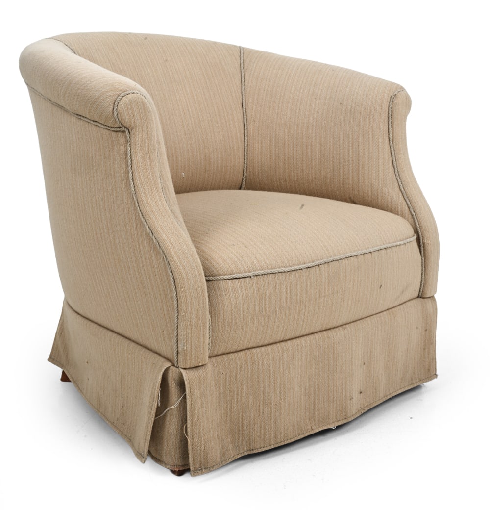 DANISH BARREL BACK LOUNGE CHAIR: Beige upholstery with cord piping and barrel back. Denmark, 20th century. Dimensions: H 27.25" x W 29.5" x D 30" x SH 12.5" Condition: Stain spots by back of seat cushion, small hole in back cushion, 