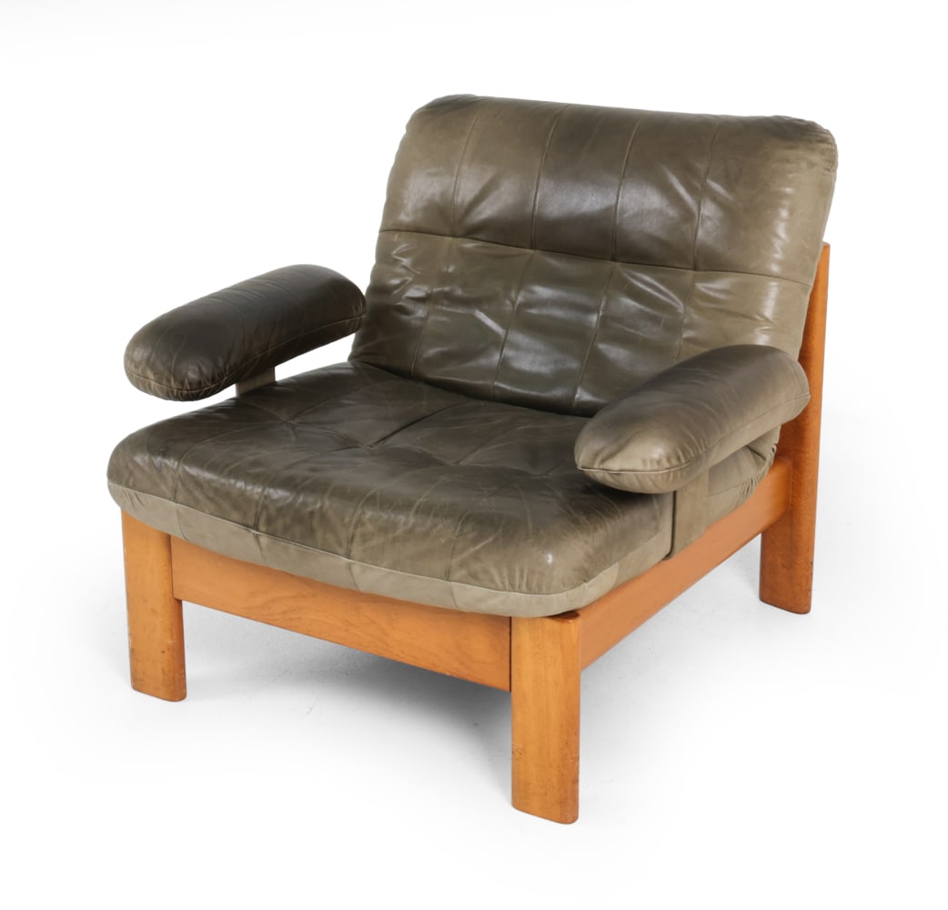 ROLF BENZ GERMAN LEATHER LOUNGE CHAIR C. 1970S: Olive leather upholstery with oak frame. Apparently unmarked. Germany, circa 1970s. Dimensions: H 29.5" x W 34.5" x D 31? x SH 16? Condition: Some scuffs. Leather is heavily darkend, Scratches . Minor