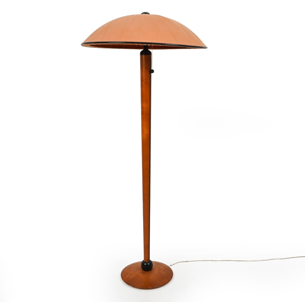 MARKSLOJD SWEDISH BEECH FLOOR LAMP: Stained beech disc base and tapered column with black lacquered spherical and linear details. Umbrella-form saucer shade. Apparently unmarked. Sweden, 20th century. Dimensions: H 51" x Dia 23.25"