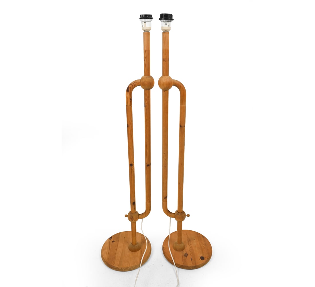 PAIR OF HOLSCHER GERMAN PINE FLOOR LAMPS: Sculptural adjustable pair of floor lamps manufactured by Holscher Leuchten. Marked to socket. 20th century. Dimensions: (As Shown) H 47" x Dia 11" Condition: Untested. European plugs, Sun fading,