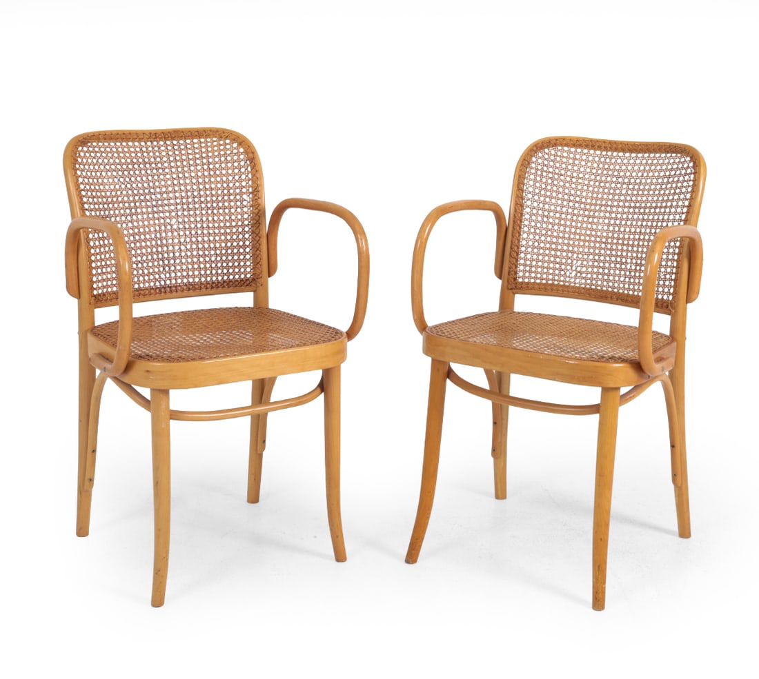 PAIR STYLE OF THONET CANE & BENTWOOD ARMCHAIRS: Beech bentwood frame with curved arms and woven cane seat and back panels. "Selection Norm" marked as retailer. Netherlands, 20th century. Dimensions: H 32''x W 18.75''x D 15''x SH 18'' Condition: