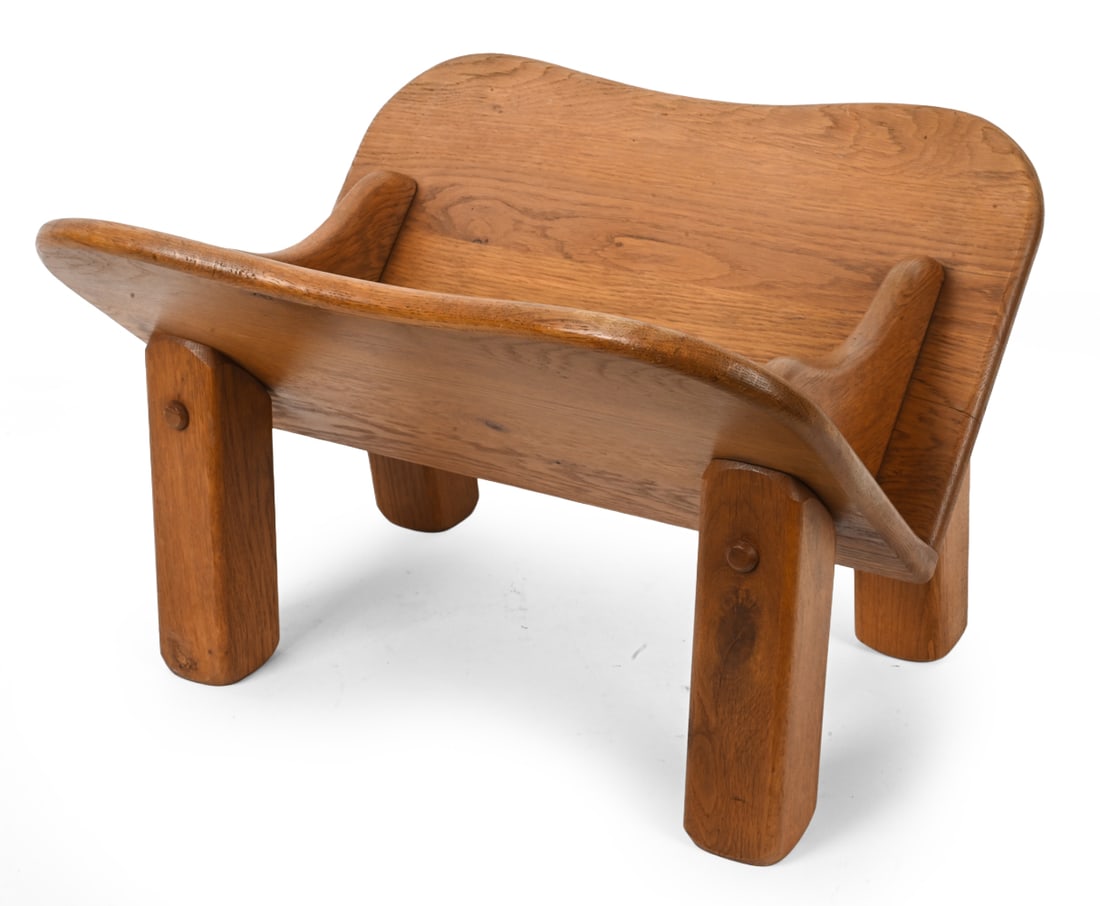VINTAGE DUTCH OAK MAGAZINE RACK: Oak magazine rack with V shaped divided through shaped side panels. 20th Century. Dimensions: H 13" x W 16" x D 19.25" Condition: Scuffs, rubs, and nicks. Wear consistent with age and use.