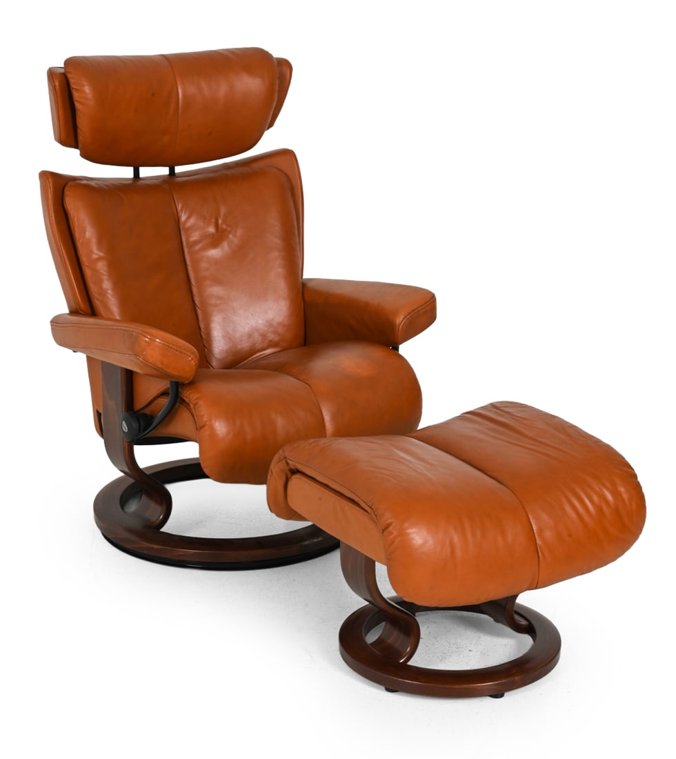 EKORNES STRESSLESS "MAGIC" LOUNGE CHAIR & OTTOMAN: Model "Magic" reclining lounge chair and matching ottoman upholstered in a cognac brown leather. Marked "Stressless" to hardware. Norway, 21st Century. Dimensions: H 43 " x W 30.5 " x D 26 " x SH 18