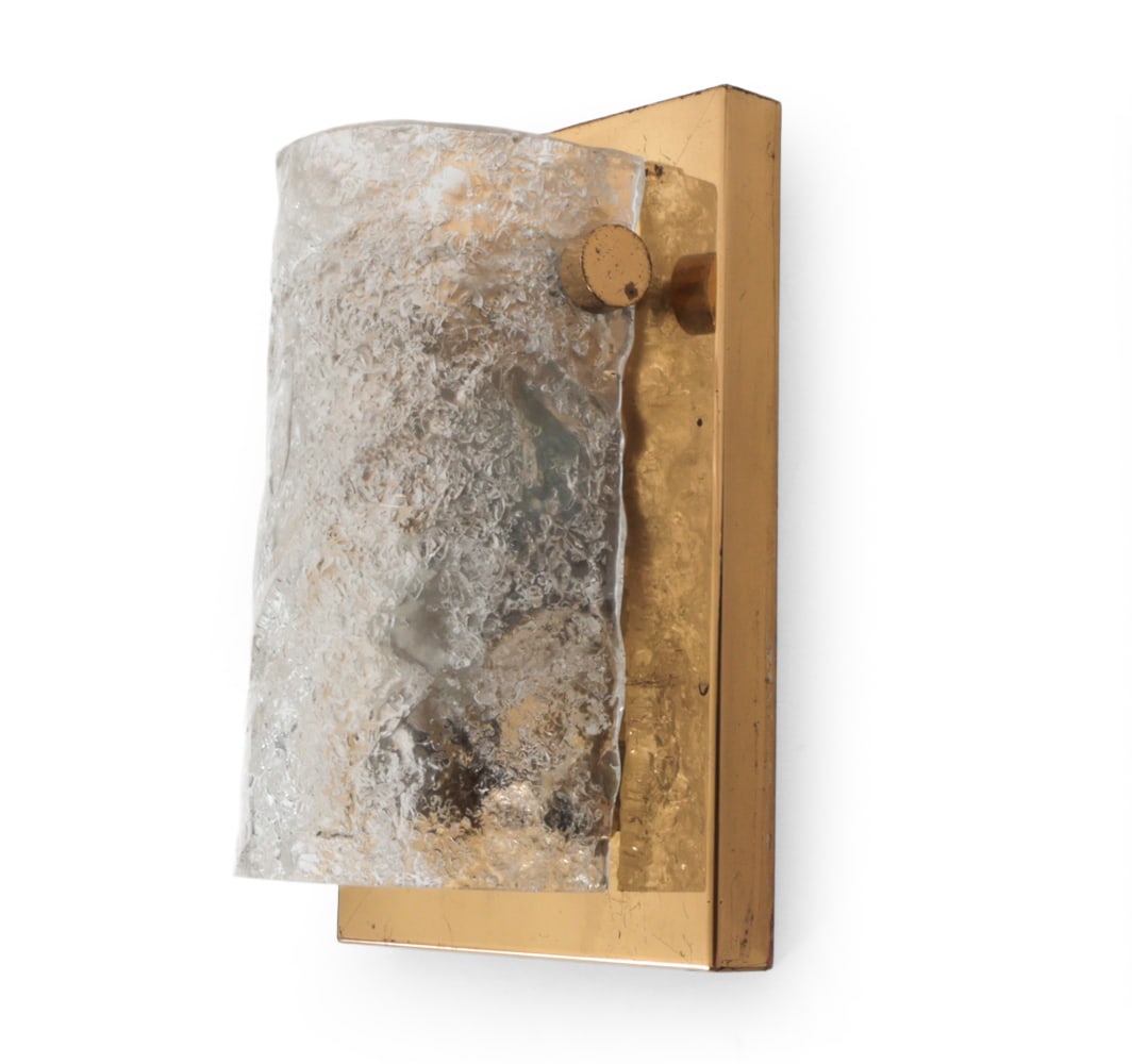EUROPEAN BRASS AND GLASS WALL SCONCE C. 1960S: Brass base and ice glass sconce. Dimensions: H 8.25" x W 5.75" x D 3.5" Condition: Tarnish to brass. Wiring untested. Wear consistent with age and use.