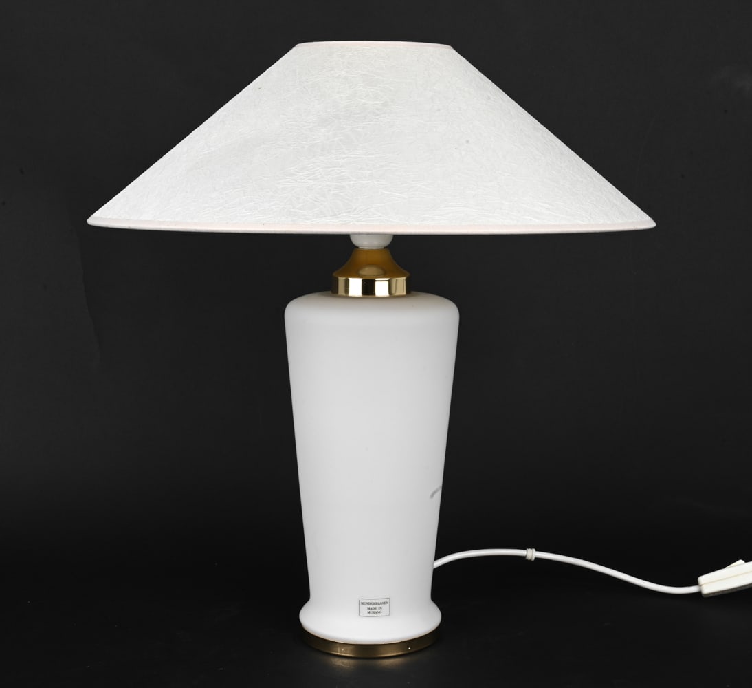 ITALIAN MURANO GLASS TABLE LAMP C. 1970S: White glass table lamp with conical shade and gold tone metal details. Marked "Made in Murano" in German. Circa 1970s. Dimensions: H 19" x Dia 17.25" Condition: Wear consistent with age and use. Untes