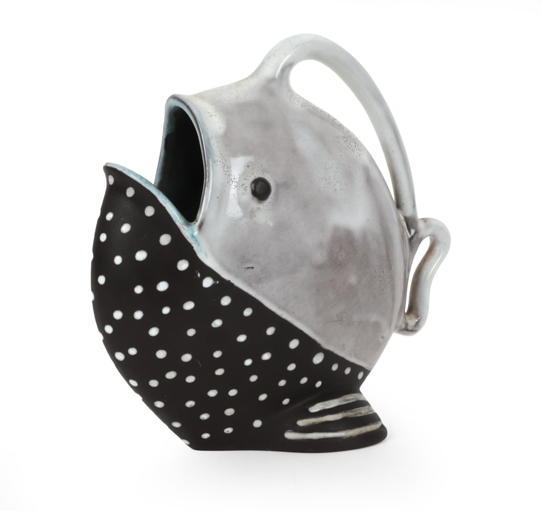 GERMAN POTTERY CERAMIC FISH PITCHER C. 1960S: Dimensions: H 9" x W 9" x D 5 " Condition: Wear consistent with age and use. Hairline crack to upper lip. Scuffs to surface. Rubs, minor paint loss to bottom.