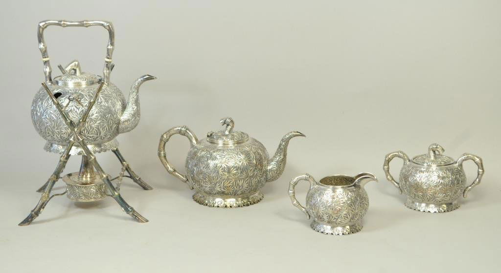 JAPANESE SILVER TEA SET: Including coffee pot, teapot with warmer and stand, sugar and creamer. Condition: Pot on stand: Damage to rods & some dents. Loose leg on base. Teapot: Broken hinge, dents on side and bottom. Sugar: D