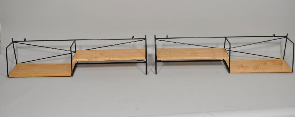 PAIR OF PAUL MCCOBB PLANNER GROUP HANGING SHELVES: circa 1950, executed in maple and black enameled steel H 8" X L 39.75" X W 8" Condition: Refinished.