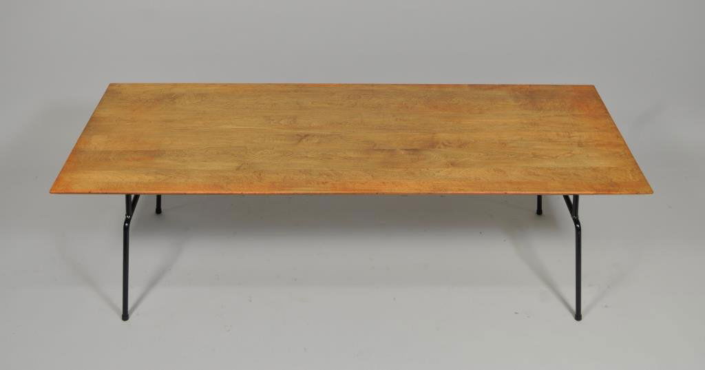 PAUL MCCOBB PLANNER GROUP COFFEE TABLE IRON BASE: circa 1950, black enameled steel H 15" X L 48" X W 18.25" Condition: Refinished, Veneer lifting on one corner.