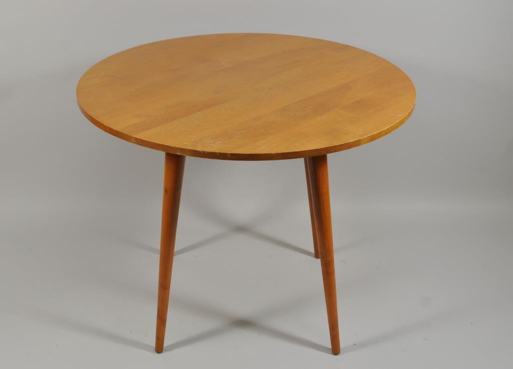 PAUL MCCOBB PLANNER GROUP ROUND TABLE: H 29.75" X DIAMETER: 36" Condition: Slight loss to top coat. Light scratches due to use and age.