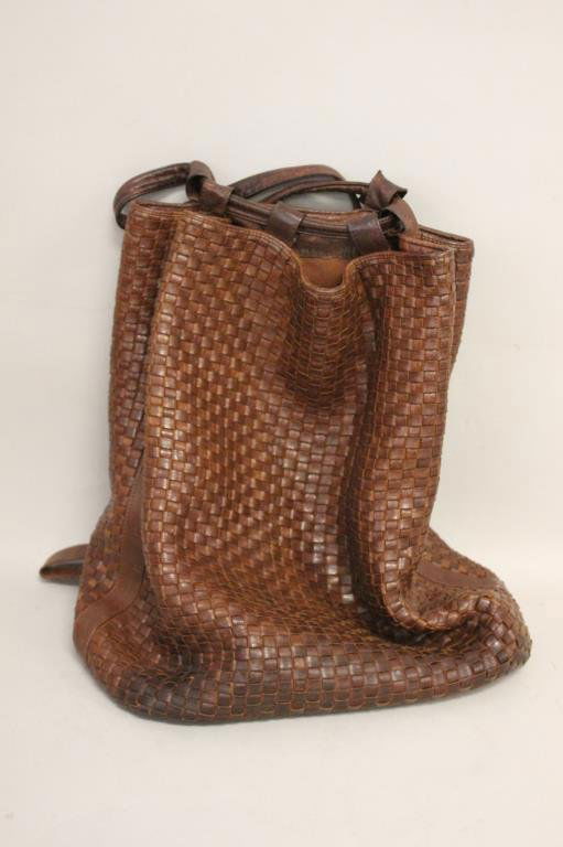 FENDI BROWN WOVEN LEATHER BACKPACK BAG: Dimension: H 16" X L 16" X W 16" Condition: Pen stains to inside bottom, broken zipper. From a Port Chester, NY Estate.