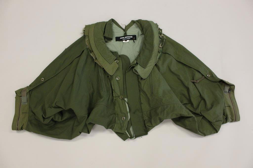 COMME DES GARCONS JUNYA WATANABE ARMY GREEN JACKET: Deconstructed design with many zippers and pockets. Original label. Cotton and nylon blend. Size: L Condition: Good, lightly used condition. No stains or rips. From a Port Chester, NY Estate.