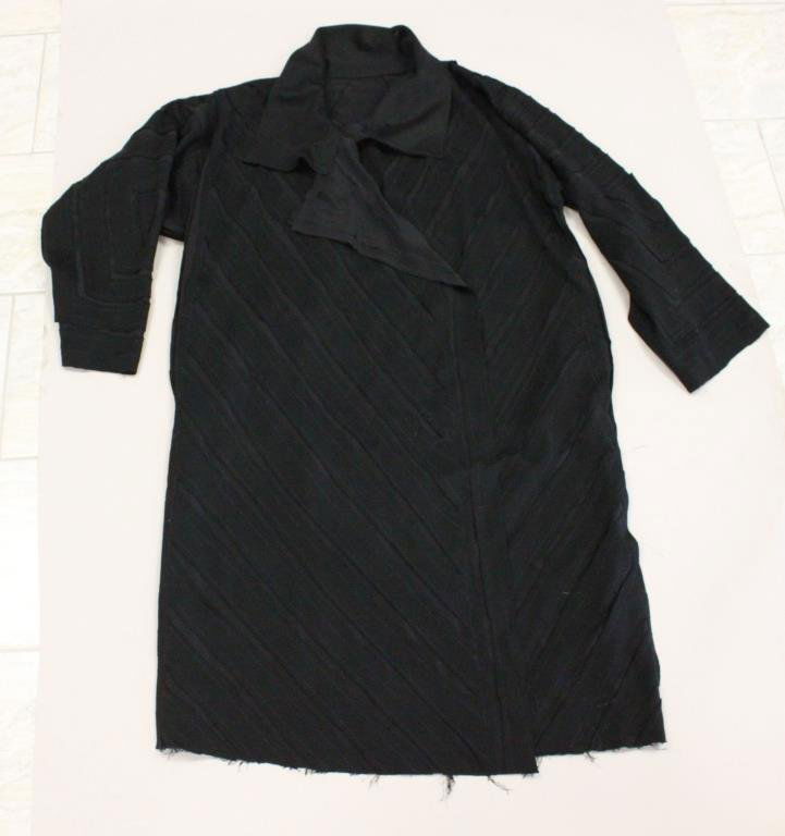 ORIGINAL DESIGNER BLACK APPLIQUE LONG COAT: No designer label. Polyester, deconstructed, applique design, blue thread, pocketed. Size: Length: 49" X Width underarm: 25" X Sleeve: 24" Condition: Good, used. From a Port Chester, NY Estate.