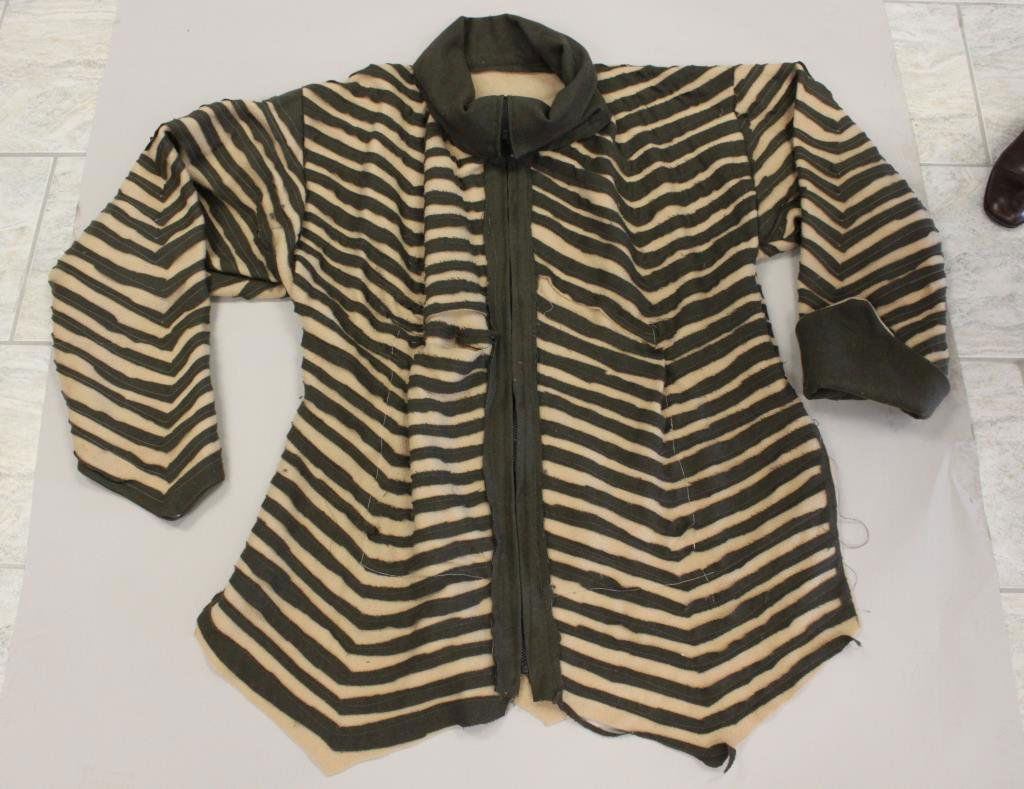 ORIGINAL DESIGNER POLAR FLEECE WOOL APPLIQUE COAT: No designer label. Green and beige poly-fleece with wool, deconstructed, applique design. Zipper close, pocketed. Size: Length: 37.5" X Width underarm: 24" X Sleeve: 23" Condition: Good, used. No stai