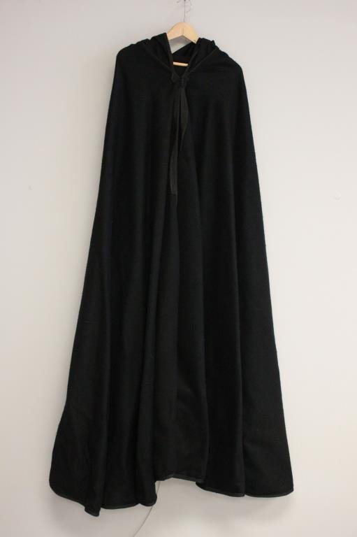 BLACK WOOL HOODED CAPE 12: Heavy-weight, felted wool. Long sleeve. Hooded with tassel. Size: Length: 57" Condition: Good, used. No staining or rips. From a Port Chester, NY Estate.