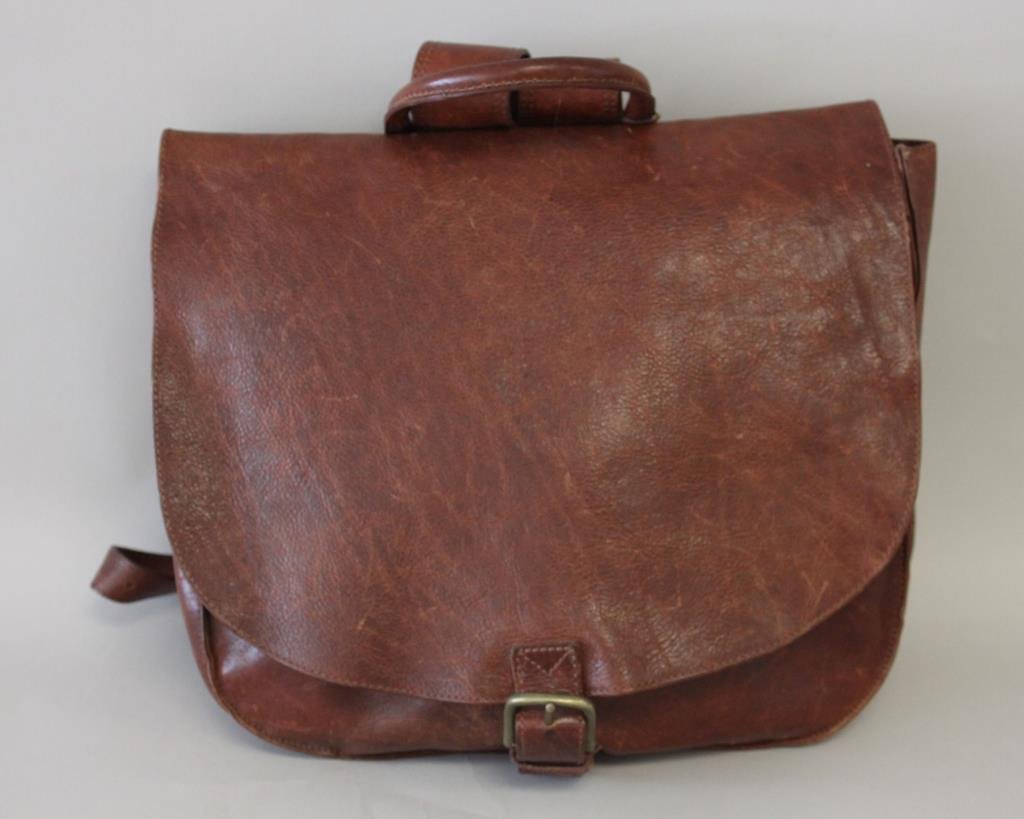 SABINA NY BROWN LEATHER BACKPACK: Inside zipper pocket and compartment. Size: H 13" X W 15.5" X D 3.5" Condition: Very good. From a Port Chester, NY Estate.
