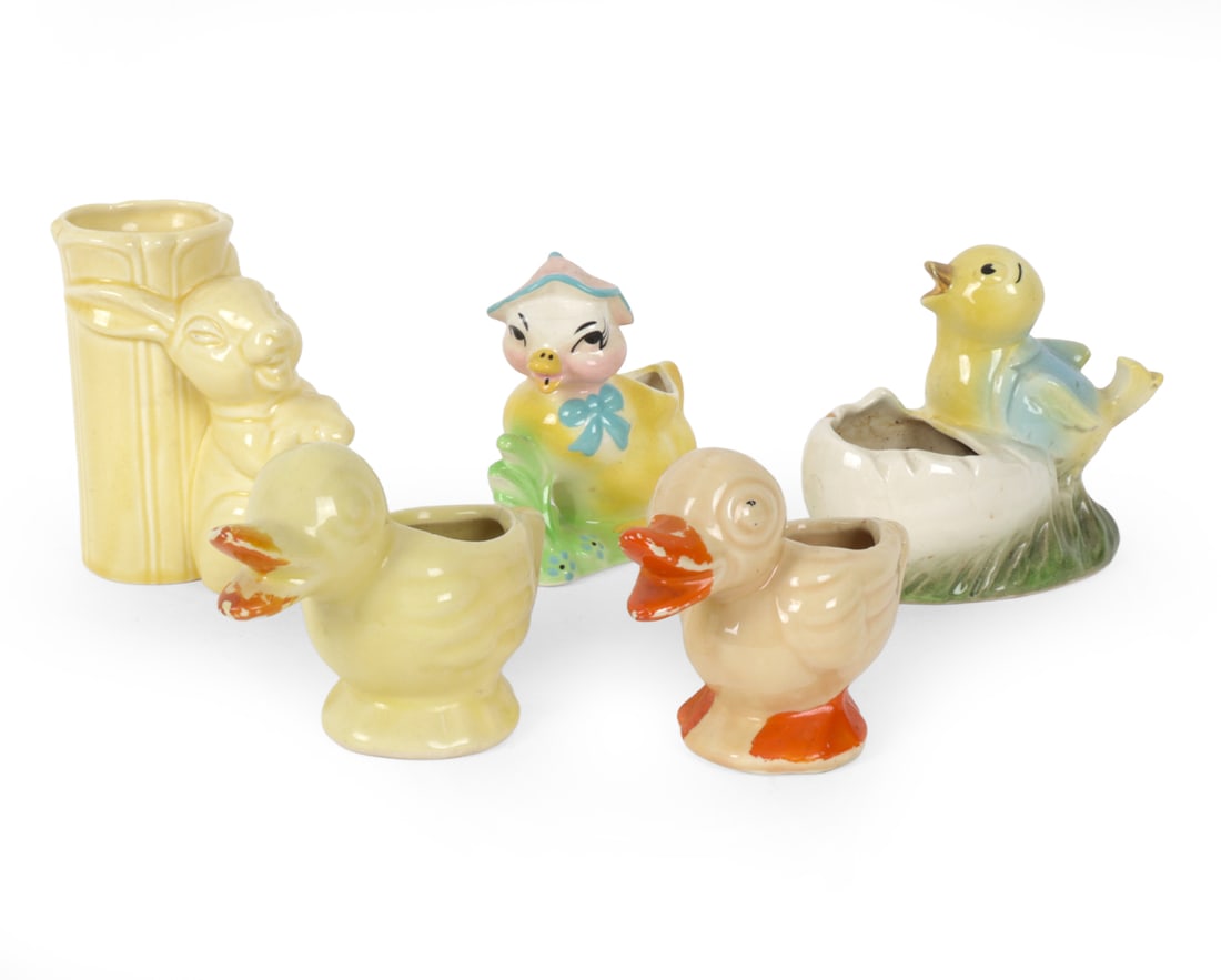 STYLE OF SHAWNEE POTTERY CERAMIC VASE GROUPING: (5) Total. Includes pair of chick vases, pair of duck vases, and rabbit vase. In the style of 1950s Shawnee Pottery. Dimensions: (Largest) H 5" x W 2.75" x D 5" Condition: Crazing to surfaces. Chips