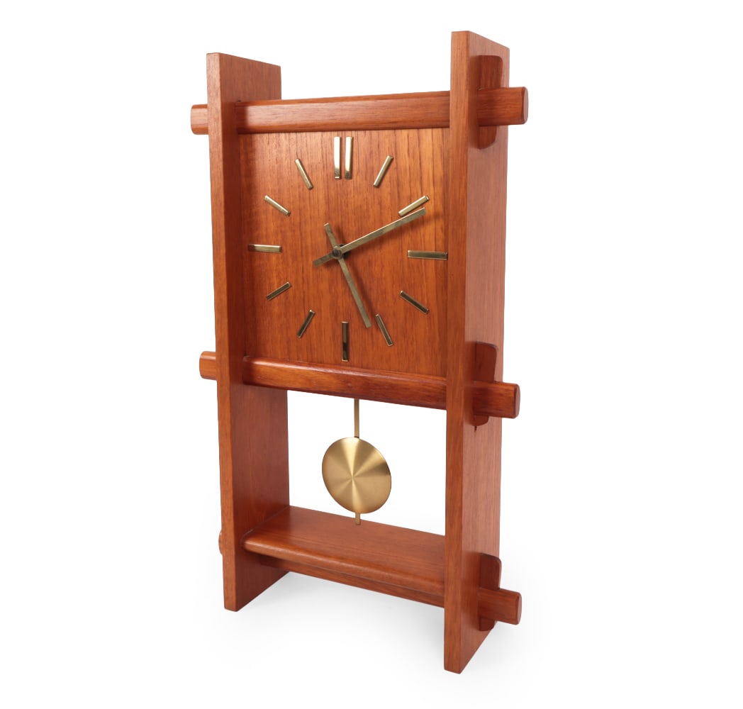 DANCLOCK DANISH TEAK WALL CLOCK C. 1960S: Wall clock. In teak. Apparently unmarked. Denmark, circa 1960s. Dimensions: H 19" x W 12" x D 3.75" Condition: Wear consistent with age and use. Time keeping untested. Scuffs, rubs, nicks.