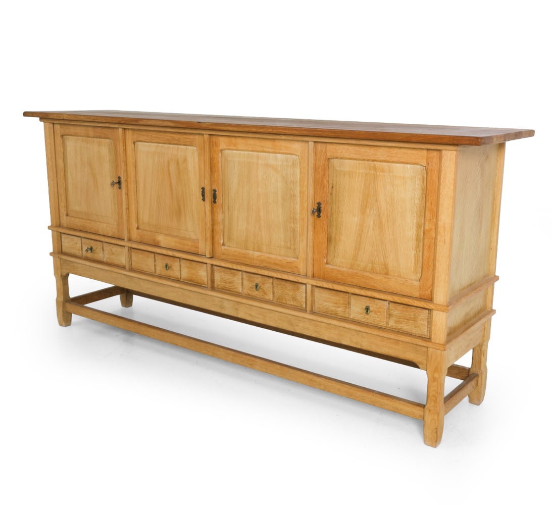 HENNING KJAERNULF FOR EG DANISH OAK SIDEBOARD: Key included. Marked to frame. Denmark, circa 1970s. Dimensions: H 40.5 " x W 86 " x D 19.75 '' Condition: Wear consistent with age and use. Discoloration and some fading. Scratches. K043