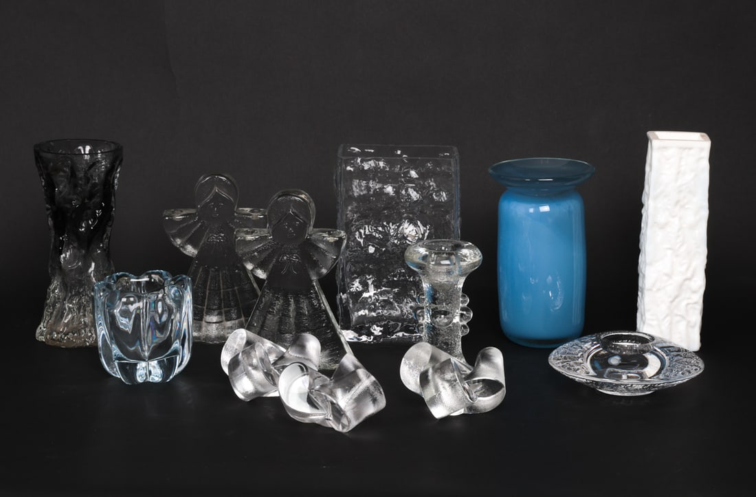 GLASS GROUPING INCL. GERMAN VASES & ANGELS 1970S: (12) Items including glass angels, vases, candlesticks and more. Dimensions: (Largest) H 7.25" x W 4.5" x D 2.5" Condition: Wear consistent with age and use. Smoked vase has minor chips to lip. Milk