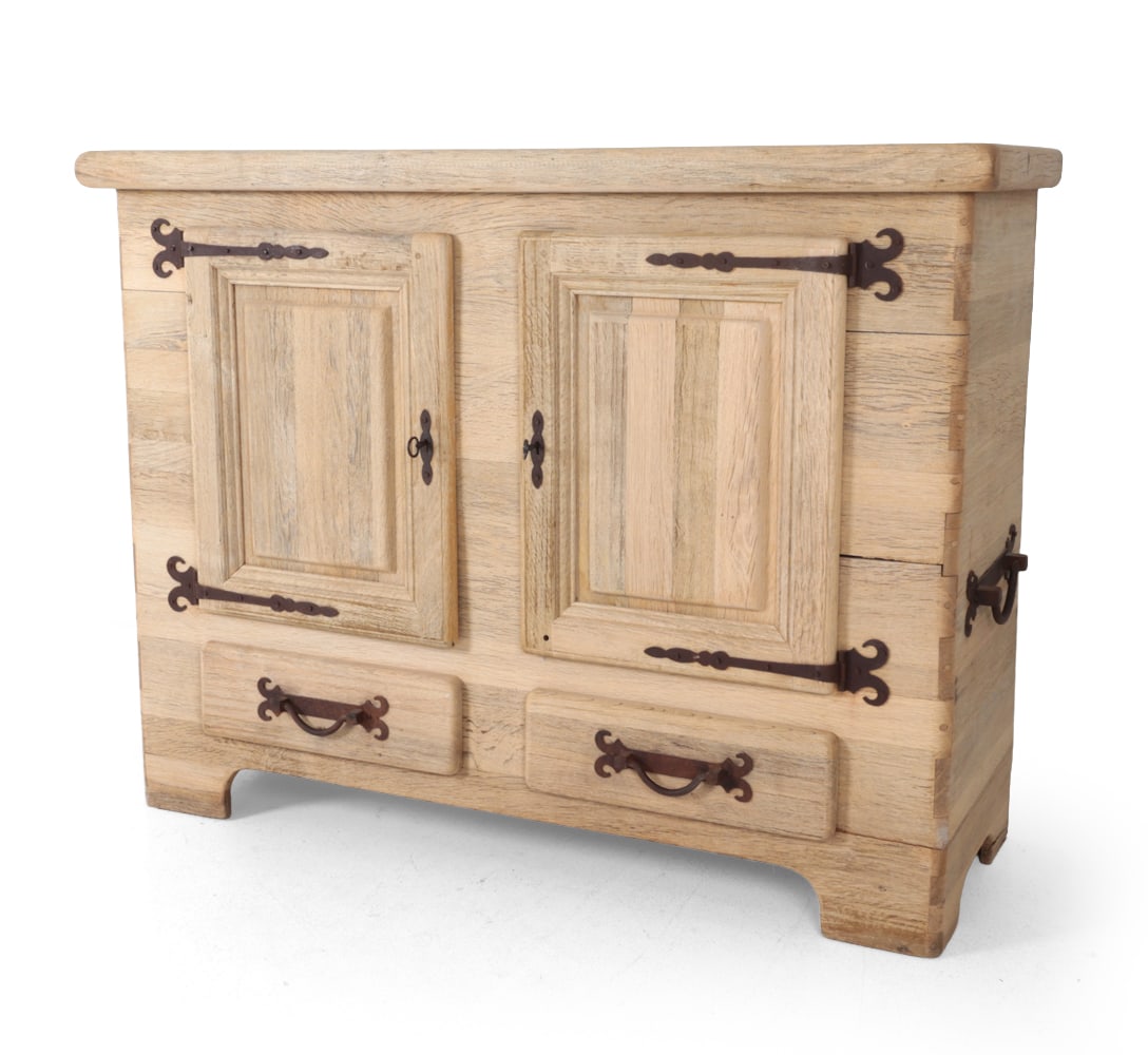 FRENCH STYLE BRUTALIST RUSTIC BLEACHED OAK CABINET: Key included. Iron hinges and handles. 20th century. Dimensions: H 49" x W 65.75" x D 23.25? Condition: Crack to back leg and bottom by drawer. Patina to hardware. Watermarks inside. Wear consistent