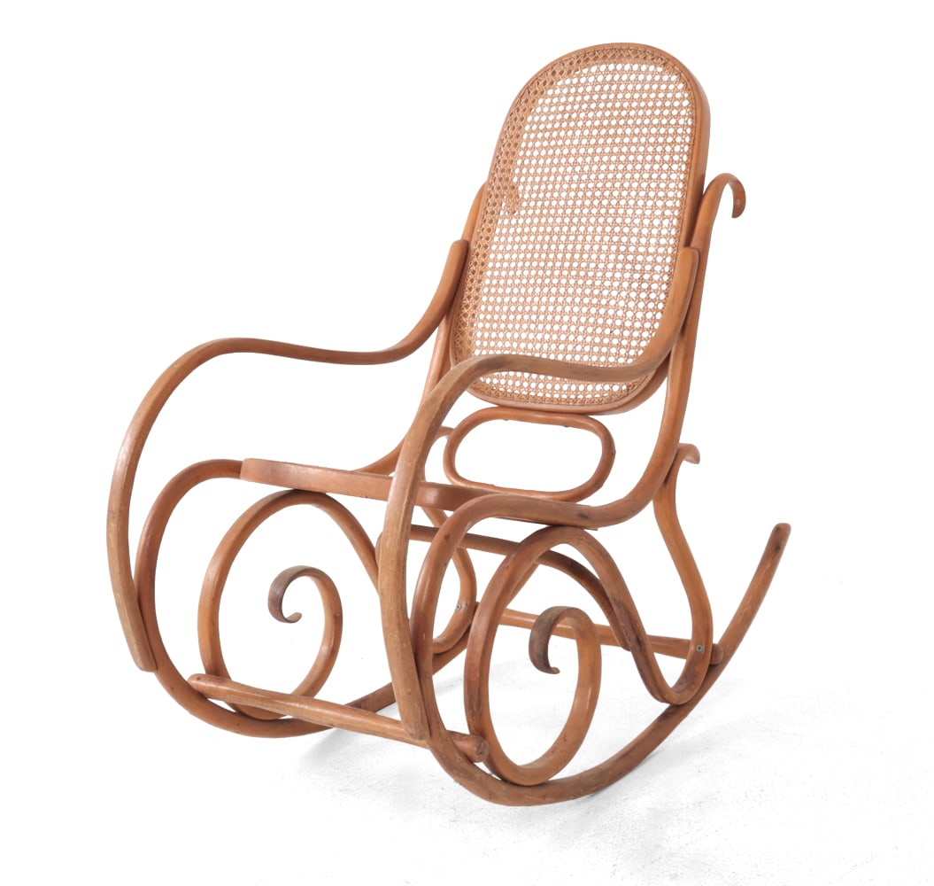 THONET BENTWOOD & CANE ROCKING CHAIR C. 1960S: Scrolled beech bentwood frame with caning seat and back. Marked to frame. Dimensions: H 40.5" x W 19.5" x D 42.5" x SH 17" Condition: Discoloration, scuffs and scratches. Wear consistent with age and