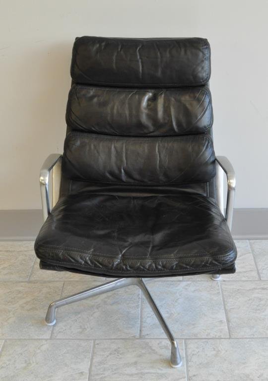 LOUNGE CHAIR CHARLES & RAY EAMES HERMAN MILLER: Soft pad leather and aluminum lounge chair Dimension: H 34.5" X L 24" X W 24" Condition: Good. Signs of use and age.