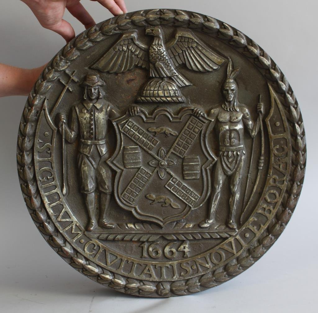 CAST IRON NY STATE SEAL: Dimensions H 18" X L 4" Condition: Good Note: Very heavy Provenance: From the collection of Marty Edelston, founder Bottom Line Publications Inc., Stamford CT.